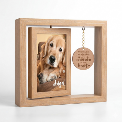 Wooden photo frame with a picture of two dogs and a engraved tag on a white background