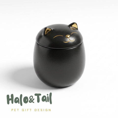 Black cat-shaped container with gold accents on a white background, featuring the brand 'Halo & Tail'.