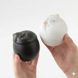 White ceramic cat urn with peaceful resting pose - Halo&Tail