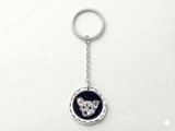 Custom sterling silver wavy edge pet portrait keychain on white background