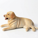 Custom realistic polymer clay pet figurine, reclining dog sculpture front view