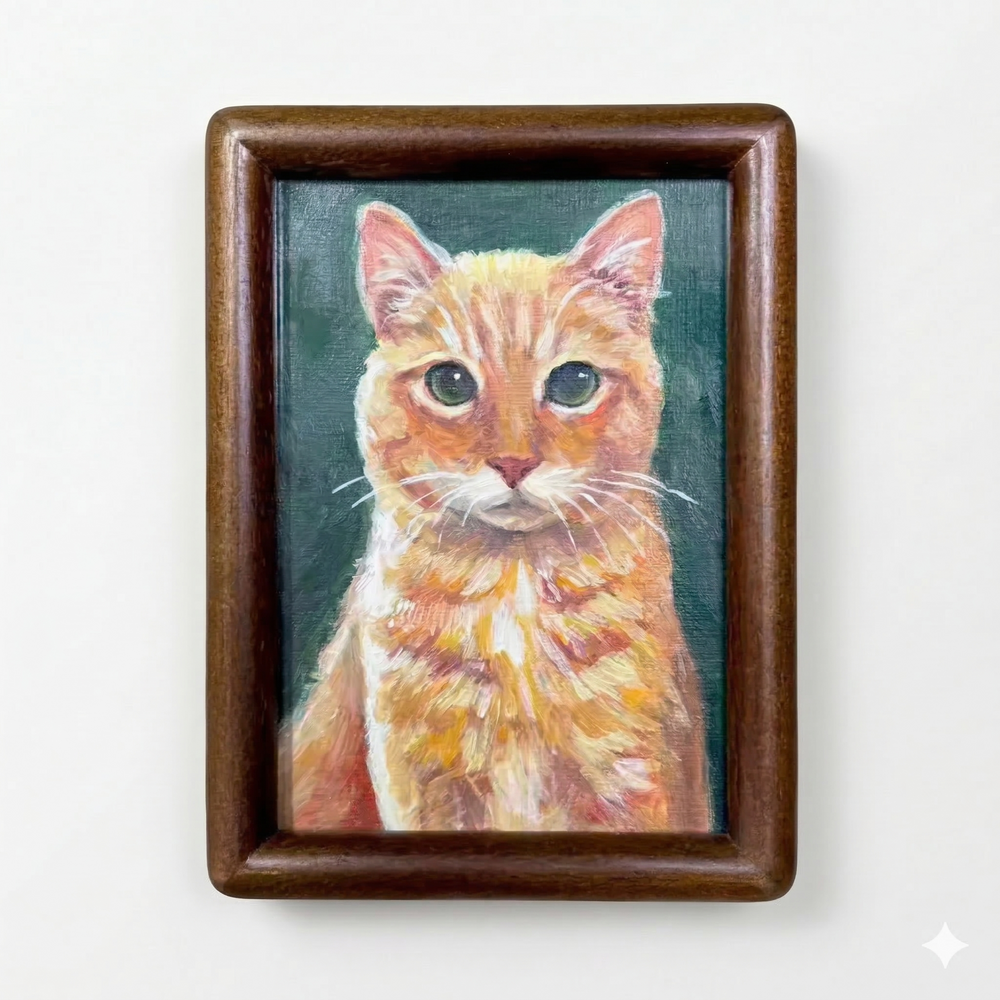 Hand-painted orange cat portrait in a dark wood style framed magnet.