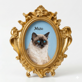 Hand-painted cat portrait in an ornate vintage-style gold magnet frame with a blue background.